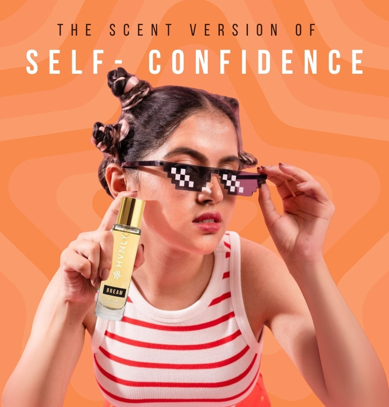 Person holding a bottle of perfume with 'The Scent Version of Self-Confidence' on an orange background