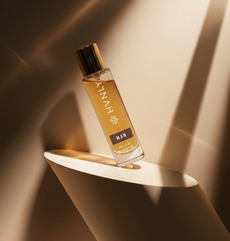 Perfume bottle labeled 'HVNLY' on a white shelf with a warm light background