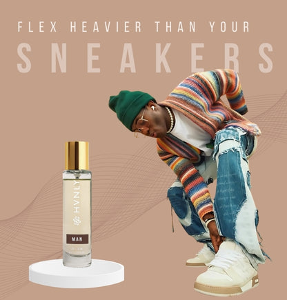 Person wearing colorful clothing and sneakers with HVNLY's MAN bottle of perfume on a beige background.