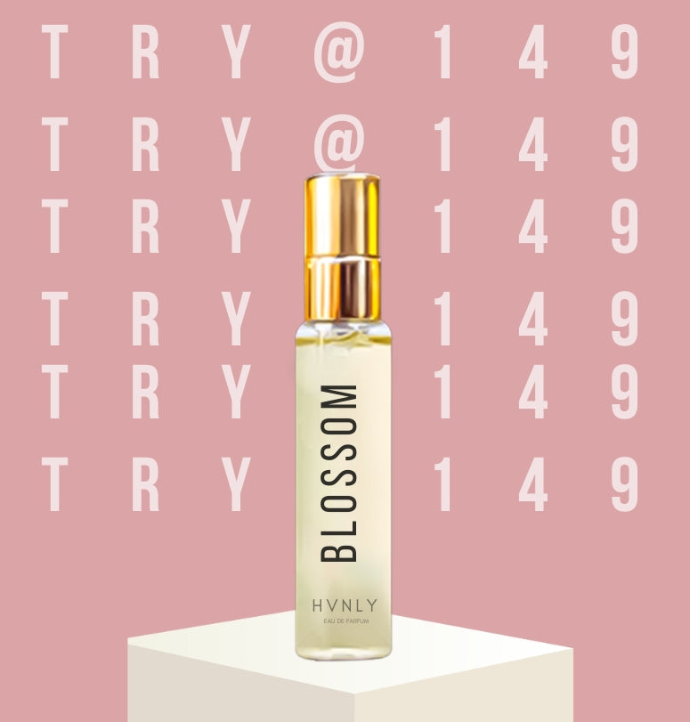 Perfume bottle labeled 'Blossom' by Hvnly on a pink background with 'TRY @149' text.