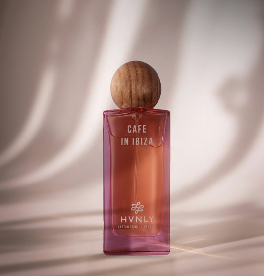 Perfume bottle labeled 'Cafe in Ibiza' by HVNLY on a beige background