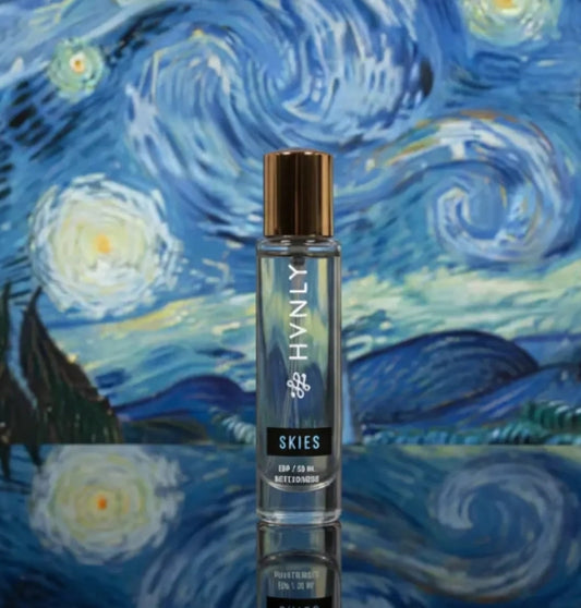 Perfume bottle- 'HVNLY's Skies' on a background resembling Van Gogh's 'Starry Night'.