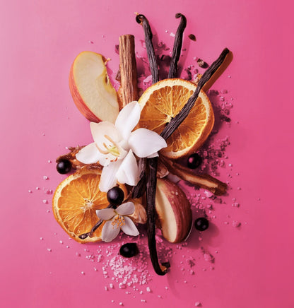 Spices and fruits on a pink background