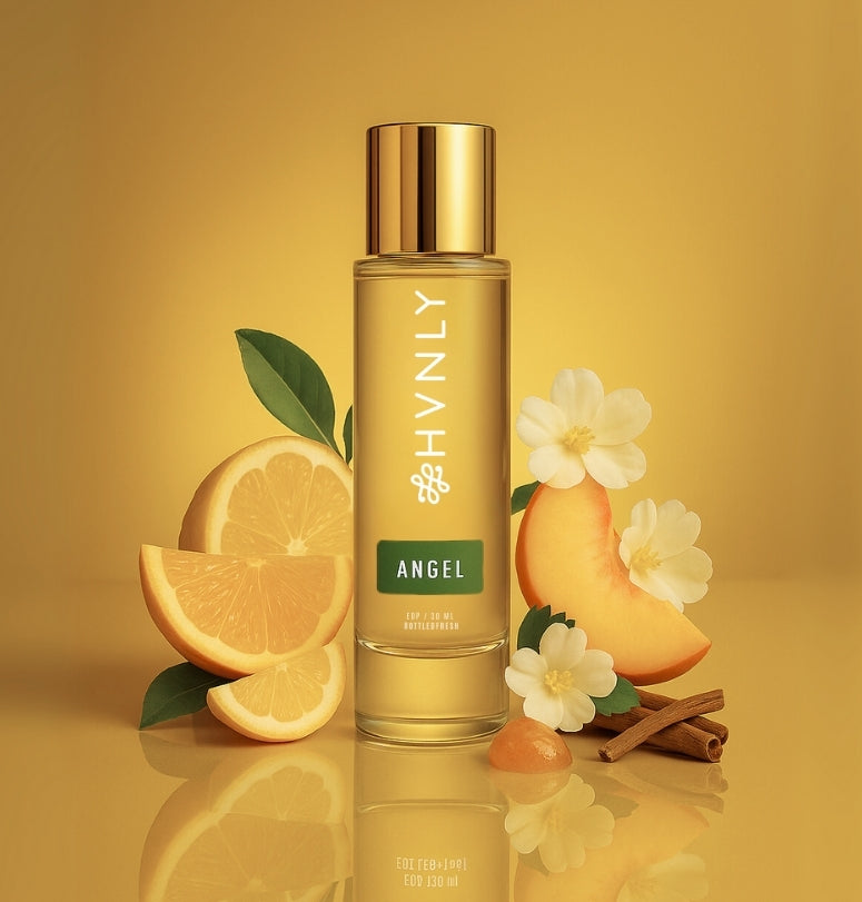 Gold bottle of HVNLY Angel perfume depicting colorful imagery of its ingredients.