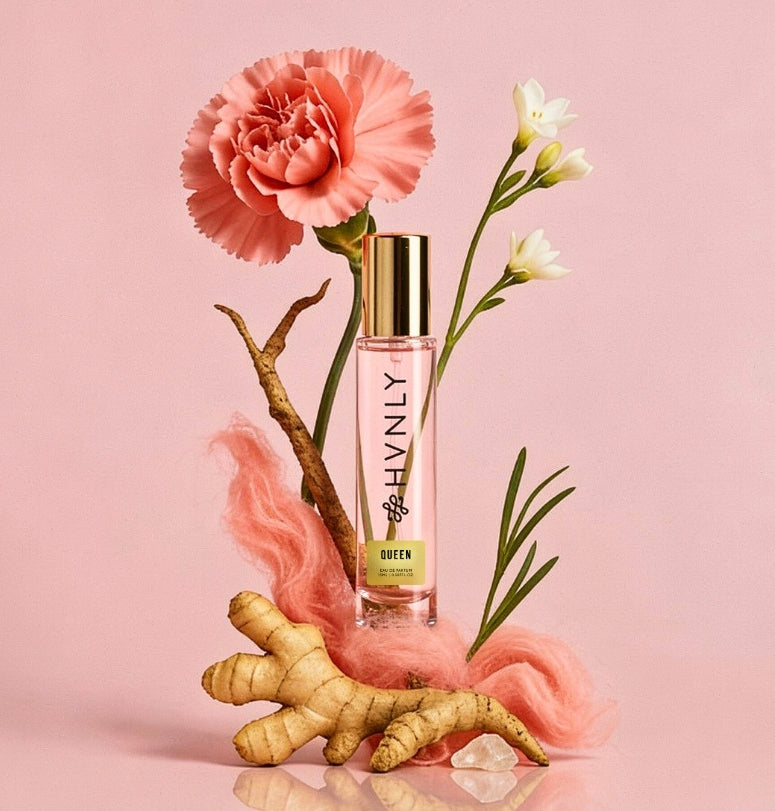 HVNLY Queen Perfume bottle with flowers and ginger root on a pink background showing notes of the perfume