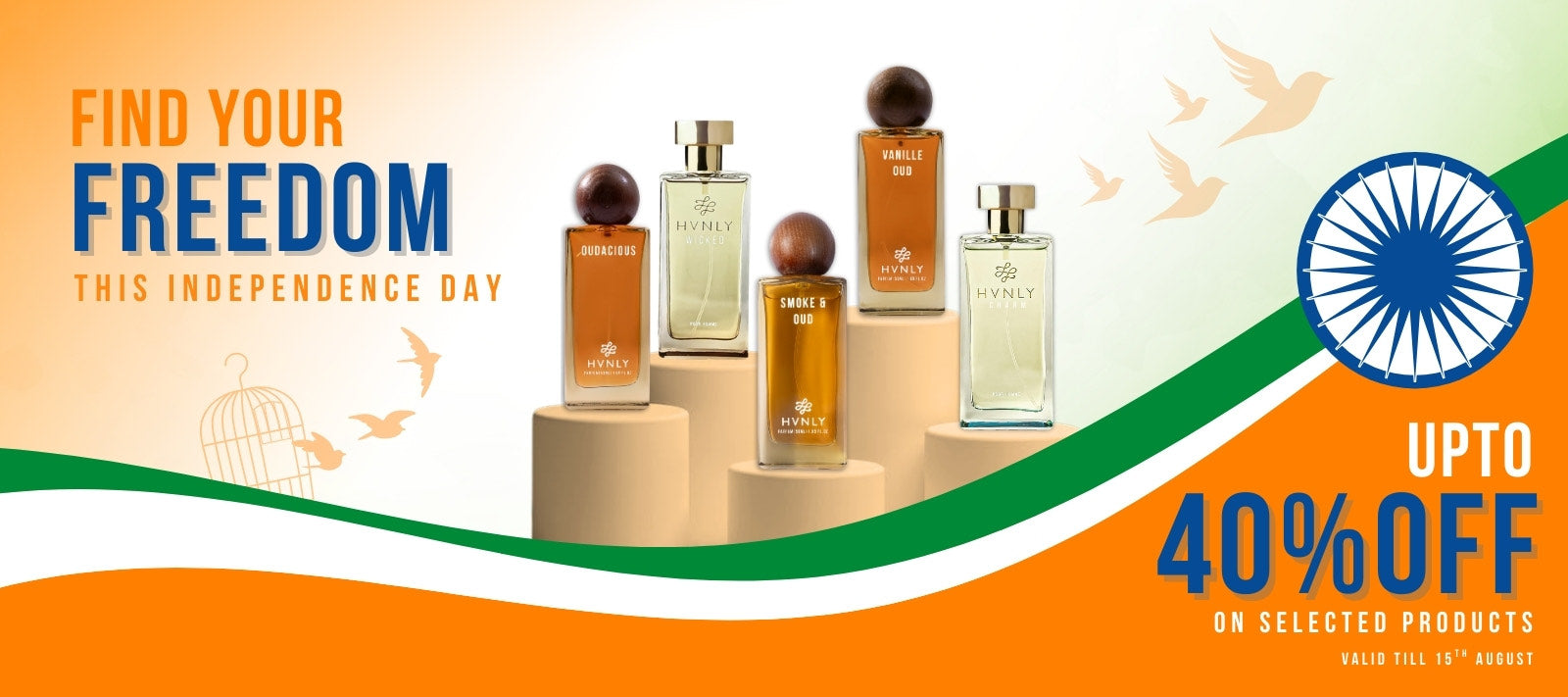 Perfume bottles on a platform with 'Find Your Freedom' text and Independence Day theme. Indicating Freedom Day Sale on selected products.