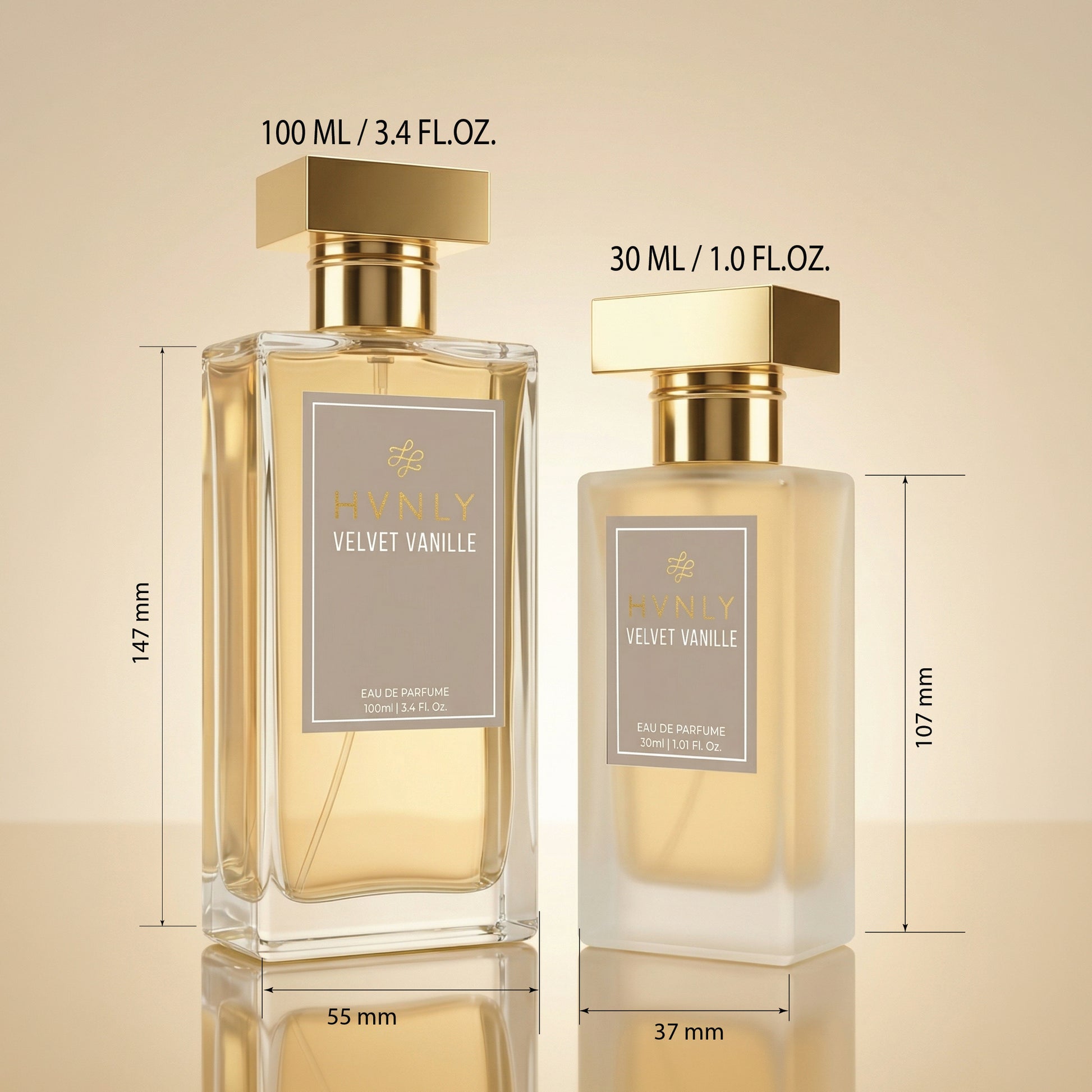 Two perfume bottles labeled Hvnly Velvet Vanille with measurements on a beige background showing the size difference in the 100ml & 30ml bottle
