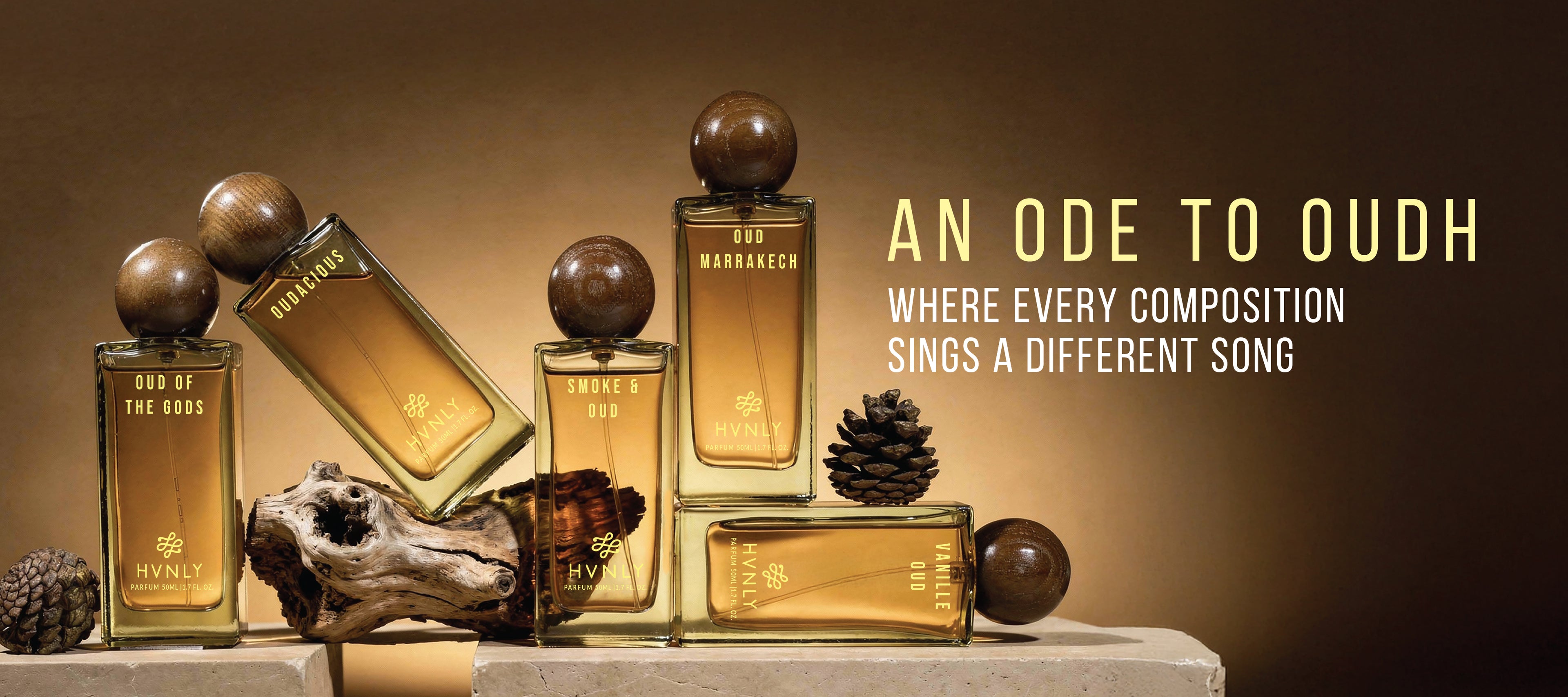 HVNLY's collection of oudh perfumes, bottles are kept with decorative elements on a brown background