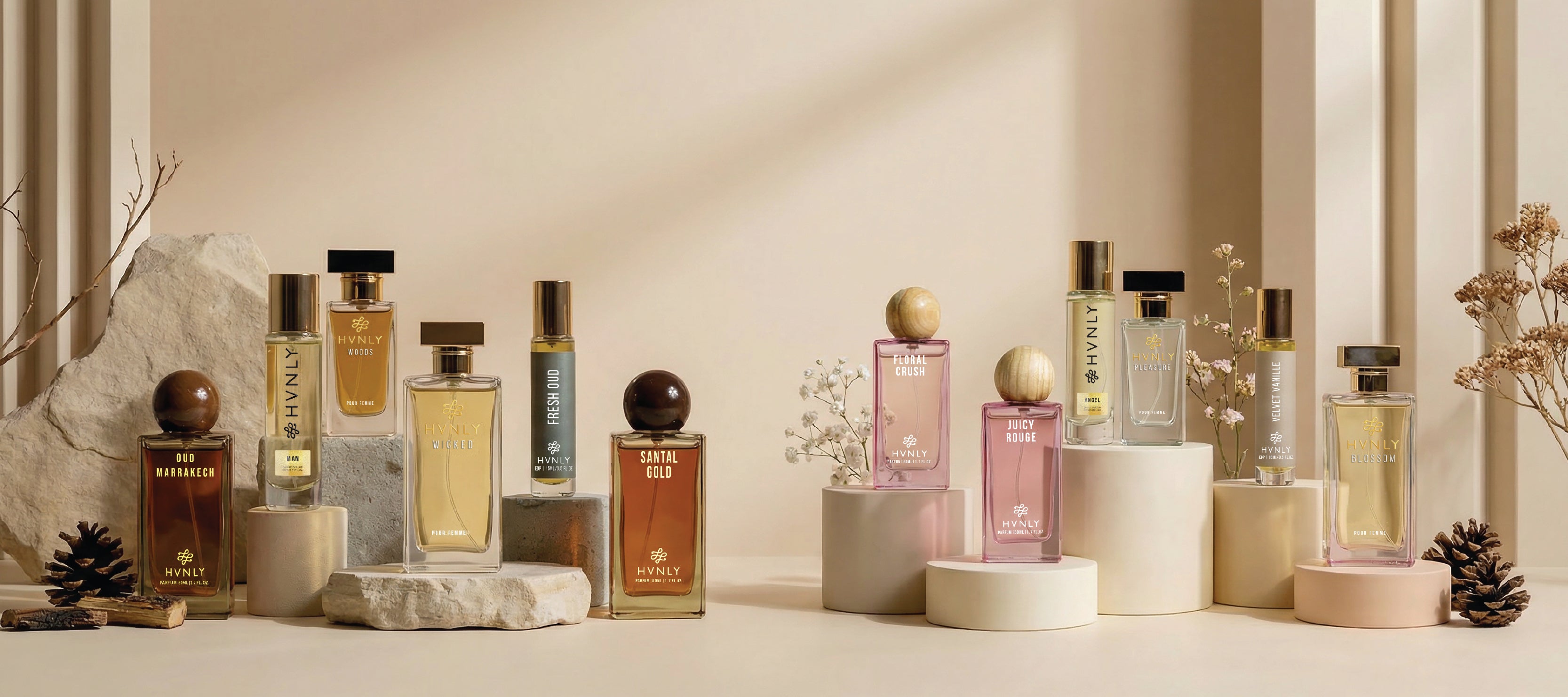 Collection of HVNLY perfume bottles on a neutral background showcased to promote the shop now section