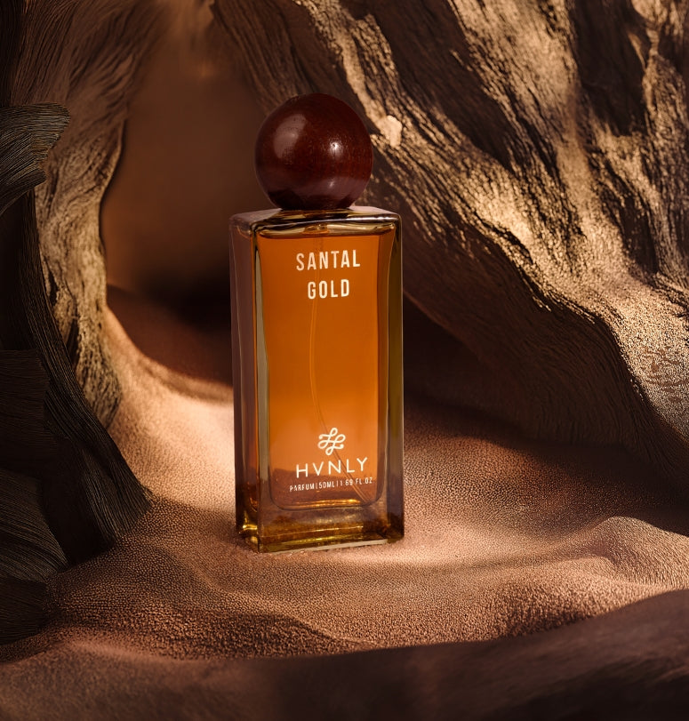 Sliding shot of the Santal Gold showcasing the top, middle and base notes of the perfume.