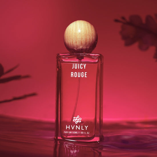 Sliding shot of Juicy Rouge perfume by Hvnly showing the top, middle and base notes of the perfume in the second shot of the video.