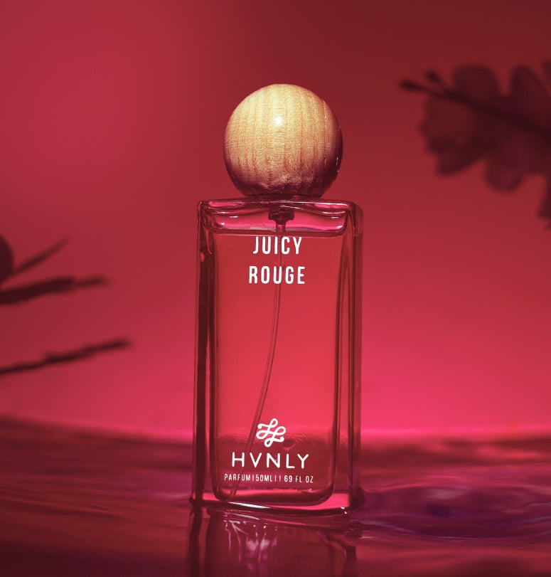 Sliding shot of Juicy Rouge perfume by Hvnly showing the top, middle and base notes of the perfume in the second shot of the video.
