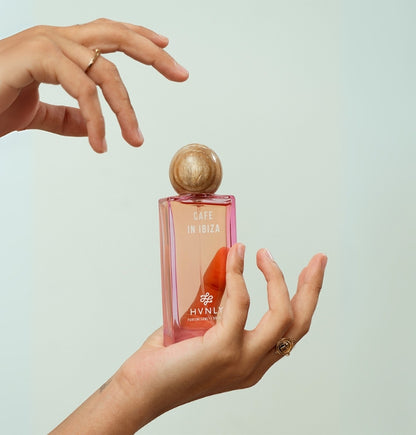 Close up shot of the perfume bottle showcasing the detailing and aesthetics  of the aesthetics of Cafe in Ibiza bottled by Hvnly.