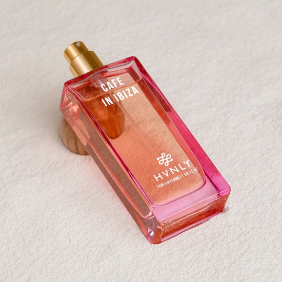 Sliding shot of Cafe In Ibiza perfume by Hvnly, showcasing the top, middle and base notes of the perfume in the next frame.