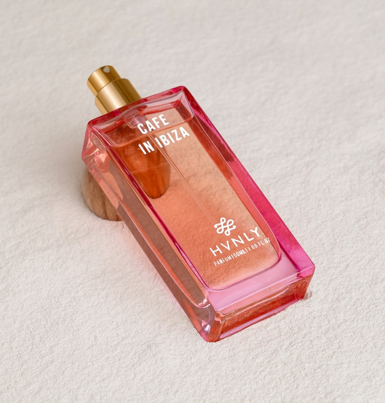 Sliding shot of Cafe In Ibiza perfume by Hvnly, showcasing the top, middle and base notes of the perfume in the next frame.