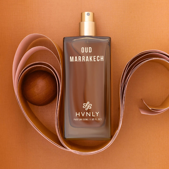 Slide shot of the Oud Marrakech perfume bottle showcasing the top, middle and base notes of the perfume.